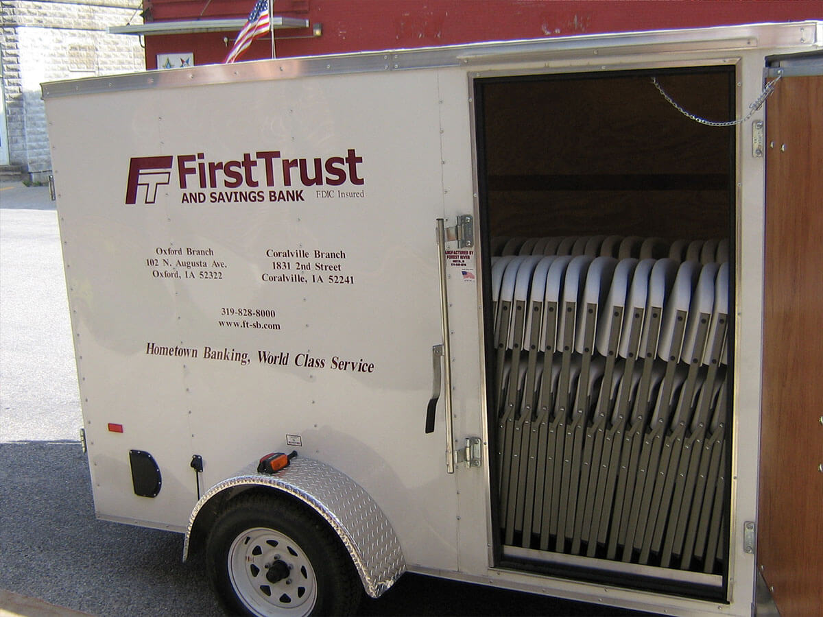 FTSB Party Trailer side door open showing folding chairs.