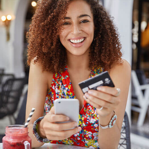 Lady checking her banking account on her cell phone.