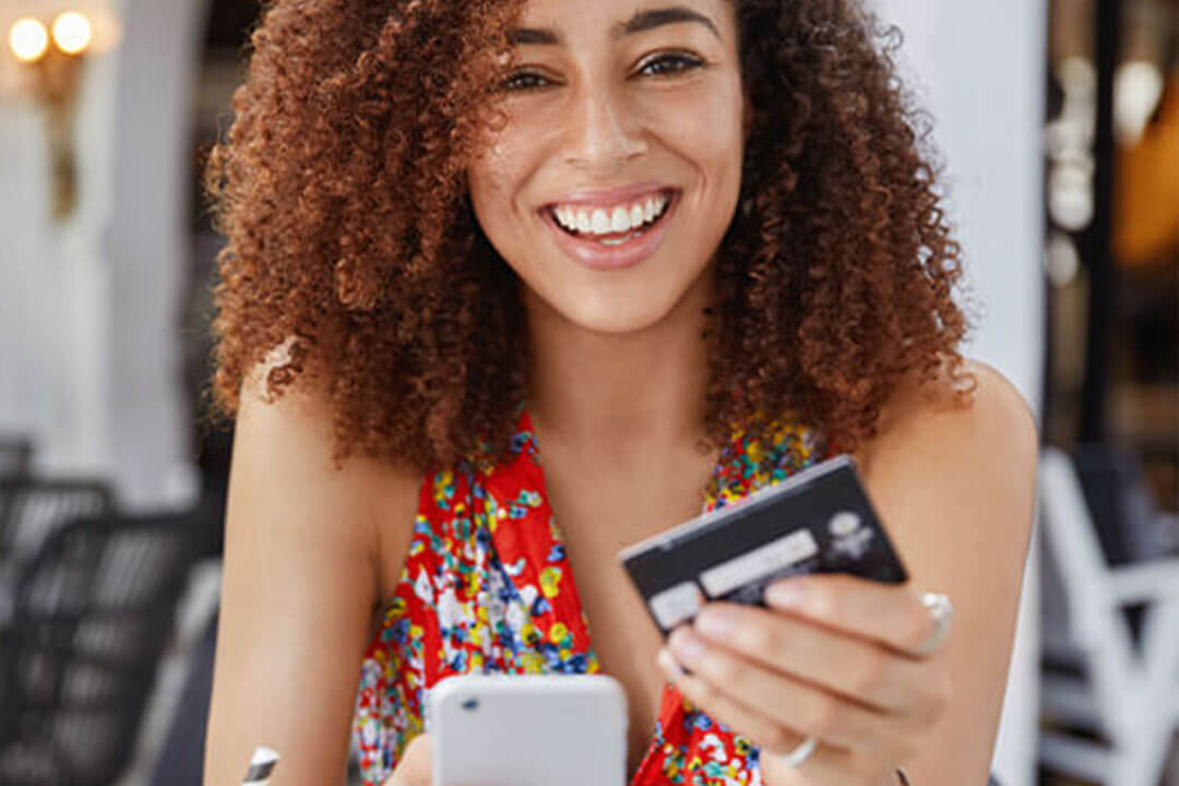 Lady checking her bank account online on her cell phone.